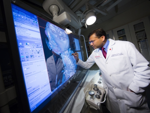 Director of the Cerebrovascular and Endovascular Program Gaurav Gupta, M.D. in angiography suite