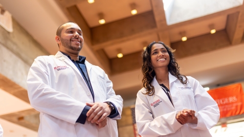 Two medical students smiling