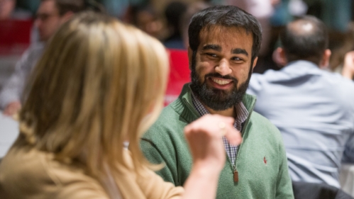 Alumni and students talk during a career night event in the medical school