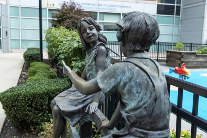 Bronze statues of children in the courtyard outside the children's hospital
