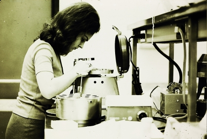 Black and white historic photo of a researcher in a lab at the medical school